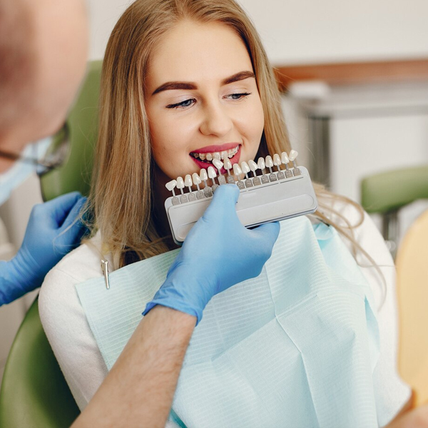 Beautiful girl sitting in the dentist's office