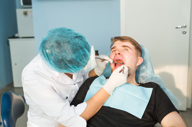 dentist-doing-dental-treatment-patient_230311-31161