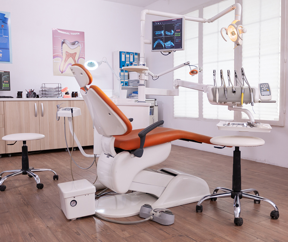 Empty modern teethcare stomatology hospital office with nobody in it equipped with dental intruments ready for orthodontist healthcare treatment. Tooth radiography images on display